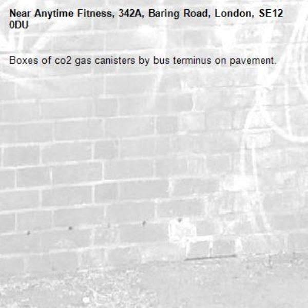 Boxes of co2 gas canisters by bus terminus on pavement.-Anytime Fitness, 342A, Baring Road, London, SE12 0DU