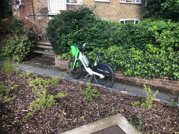 Junction of Westhorne Avenue. Please clear an Abandoned Lime bike-Rowan Court, Burnt Ash Hill, London, SE12 0HS