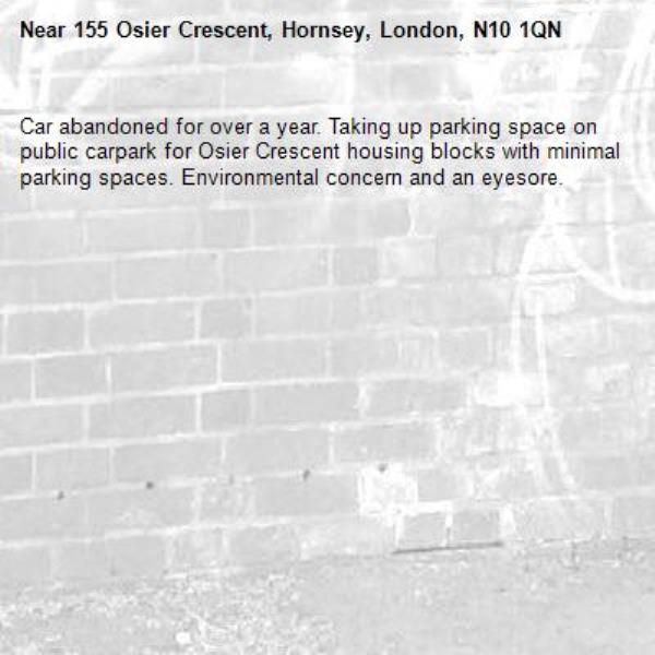 Car abandoned for over a year. Taking up parking space on public carpark for Osier Crescent housing blocks with minimal parking spaces. Environmental concern and an eyesore.-155 Osier Crescent, Hornsey, London, N10 1QN
