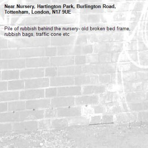 Pile of rubbish behind the nursery- old broken bed frame, rubbish bags, traffic cone etc-Nursery, Hartington Park, Burlington Road, Tottenham, London, N17 9UE