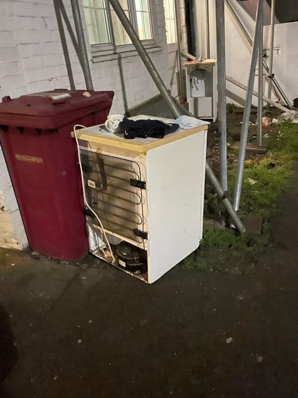 Suspected that this small fridge belongs to 13 Baker St where work is being done on the property and they have a tip outside on Anstey Road at the entrance. This is on the public pavement. They need to take care of their own rubbish coming out of this house.-13 Baker Street, Reading, RG1 7XT