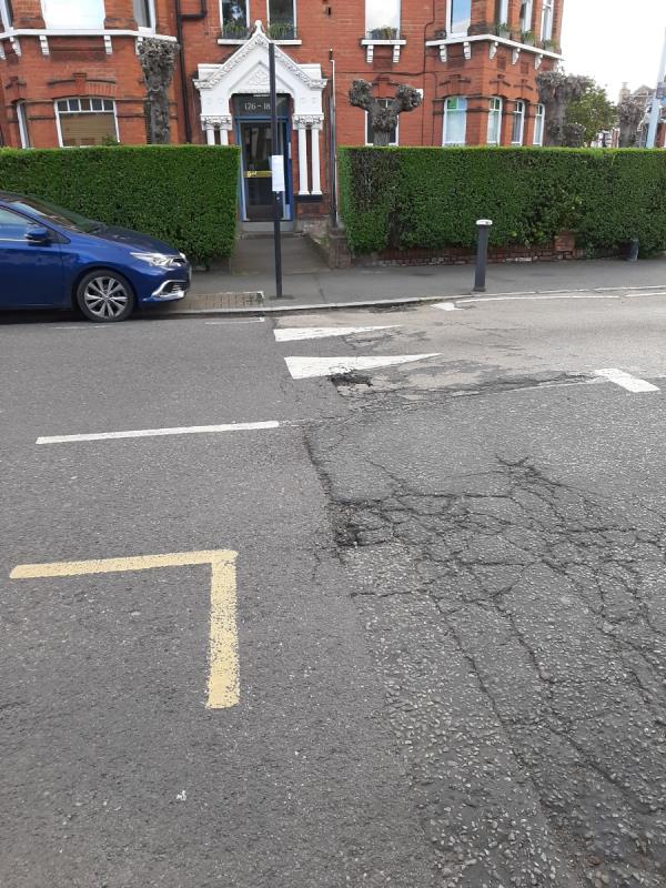 Pothole at edge of speed hump-Flat 1, 149 Ferme Park Road, Hornsey, London, N8 9BP