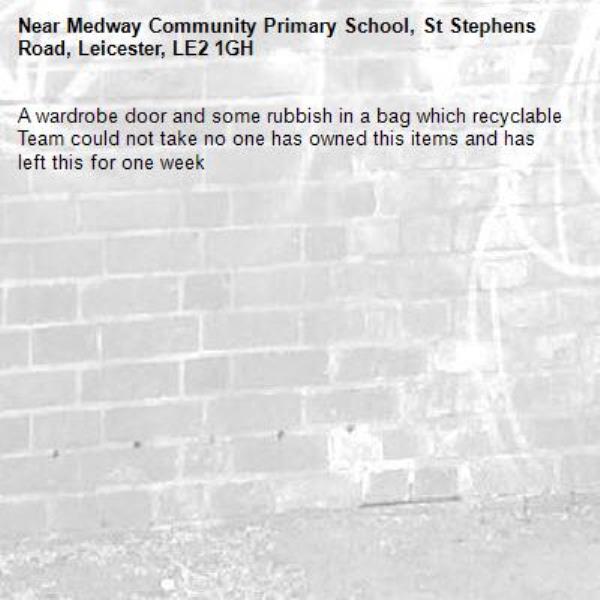 A wardrobe door and some rubbish in a bag which recyclable Team could not take no one has owned this items and has left this for one week-Medway Community Primary School, St Stephens Road, Leicester, LE2 1GH