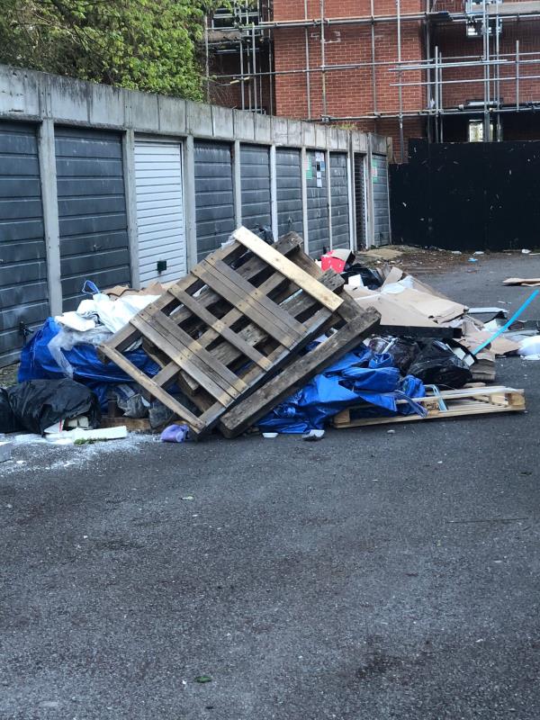 Huge truck load of waste was fly-tipped outside the garages of Robins Court, Chinbrook Road. We asked the man to not dump his stuff there but he just drove off. 
The number plate for the white van is RX07 JUH-94 Chinbrook Road, Grove Park, London, SE12 9QW