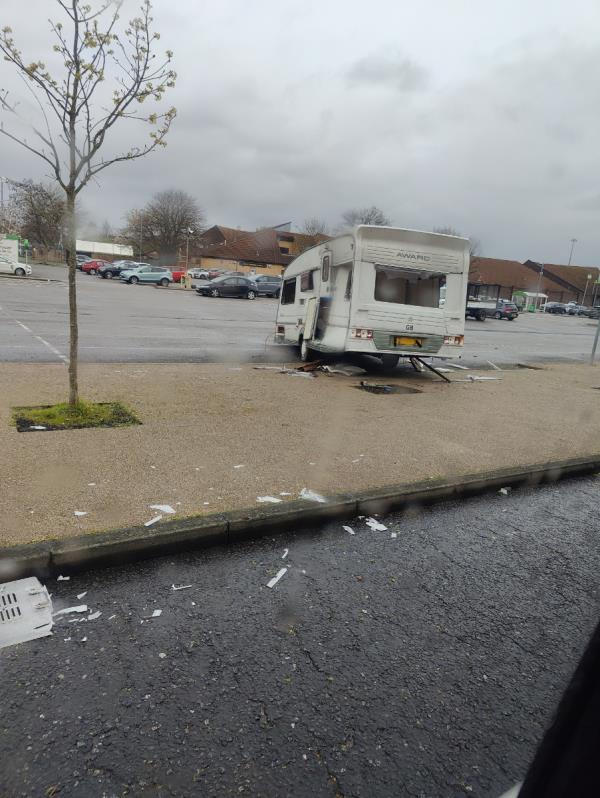 Abandoned trailer, one day kids will set it on fire as they are smashing it every night. Take asda to court if needed and tell them to remove it. -Beckton District Park