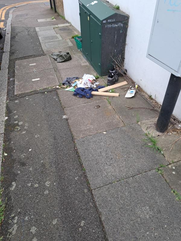 Litter has been on pavement for at least 3 days.-Wistaria House, Wallbutton Road, London, SE4 2NZ