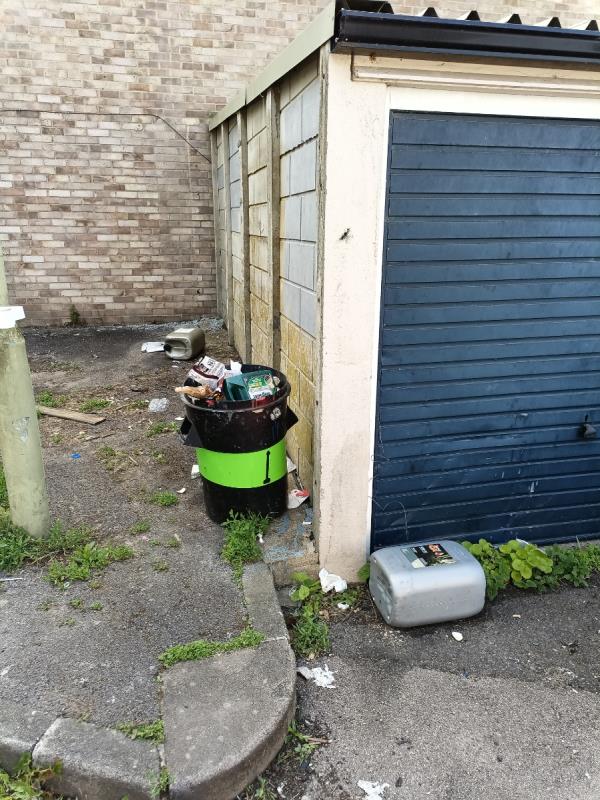 Items dumped by garages on both sides 4-5 items in total -15 Bede Walk, Reading, RG2 7UE