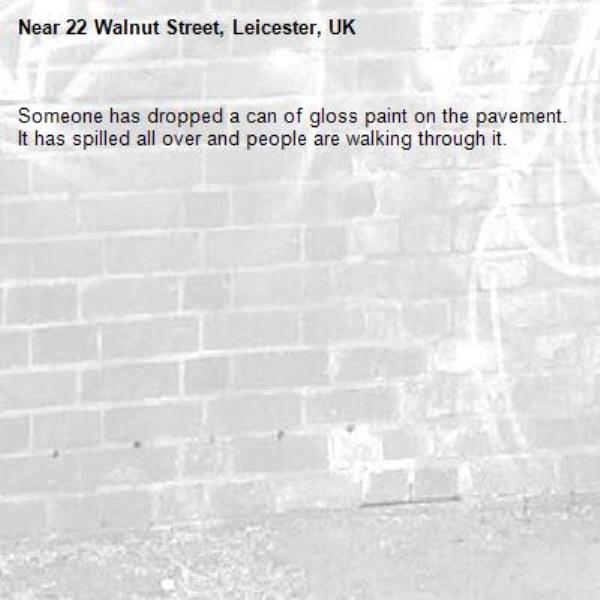 Someone has dropped a can of gloss paint on the pavement. It has spilled all over and people are walking through it.-22 Walnut Street, Leicester, UK