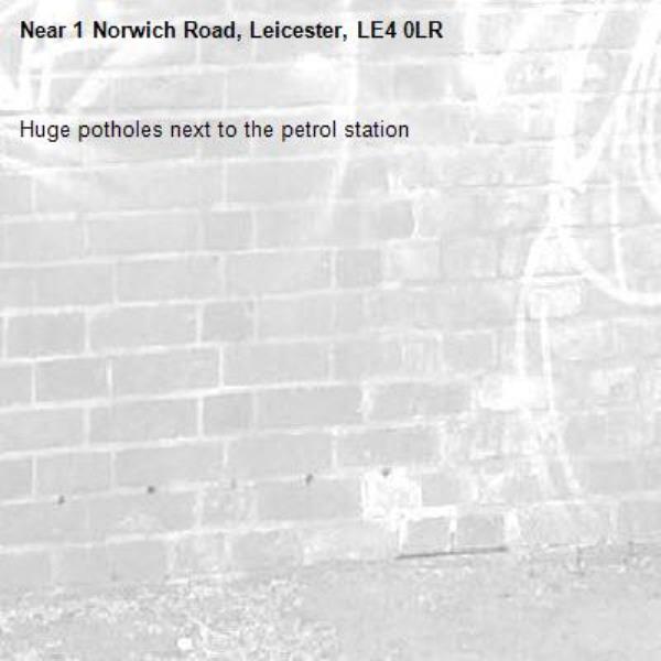 Huge potholes next to the petrol station-1 Norwich Road, Leicester, LE4 0LR
