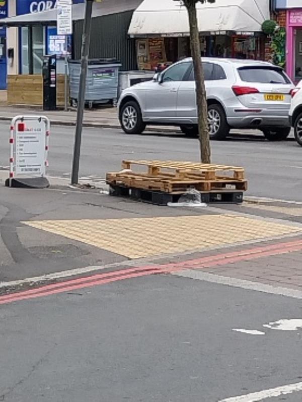 3 pallets dumped by tree-Flat 1, 1B, Connaught Road, Reading, RG30 2UD