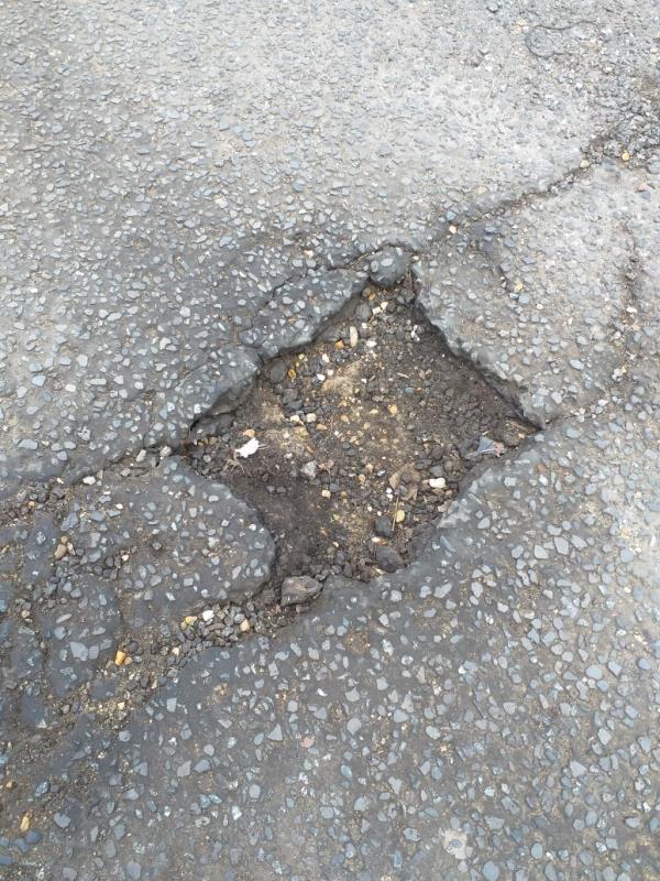 There is a big hole in the road outside no 17 sprowston road. Dangerous to traffic, can damage vehicles.-21 Sprowston Road, Forest Gate North, E7 9AD, England, United Kingdom