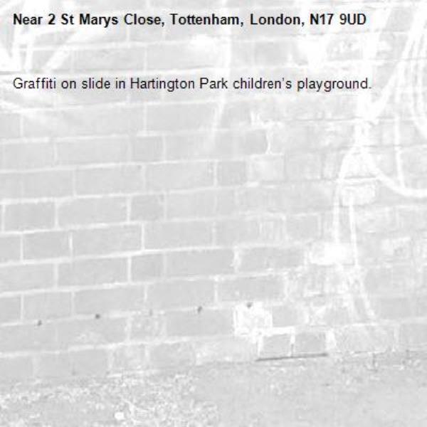 Graffiti on slide in Hartington Park children’s playground. -2 St Marys Close, Tottenham, London, N17 9UD
