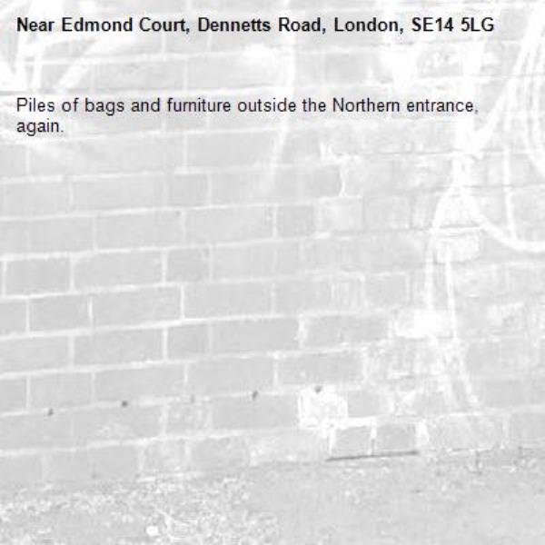 Piles of bags and furniture outside the Northern entrance, again.-Edmond Court, Dennetts Road, London, SE14 5LG