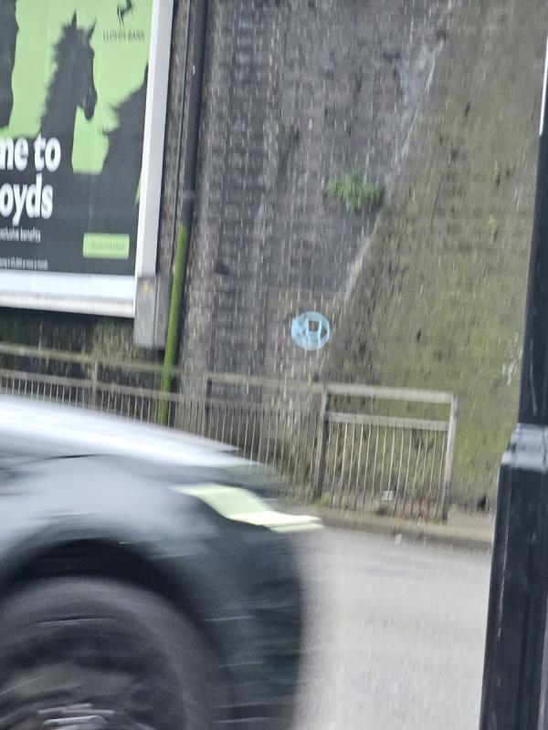 Tagging on iron bridge wall-Greenford Road, Southall
