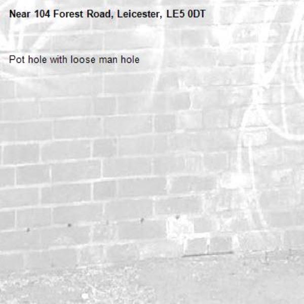 Pot hole with loose man hole-104 Forest Road, Leicester, LE5 0DT