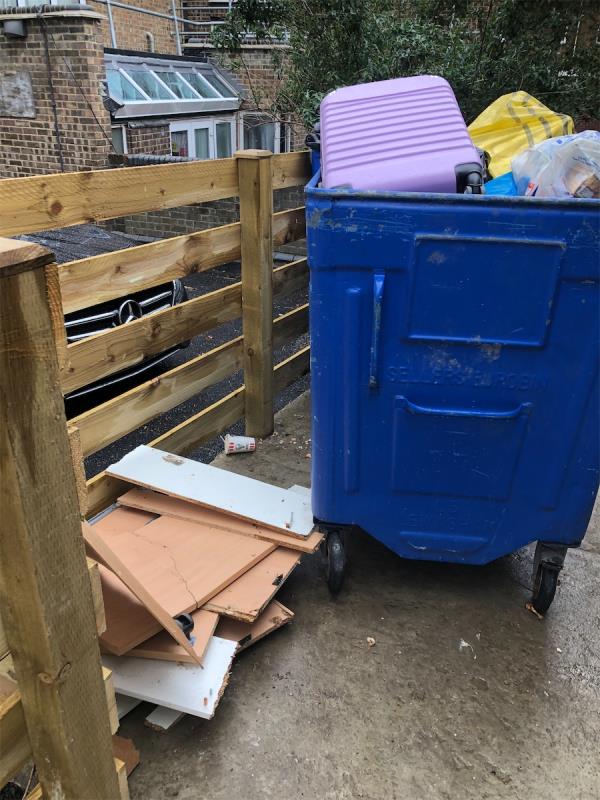 Please clear flytip of wood from by Hostel bins-5 Baring Road, London, SE12 0JP