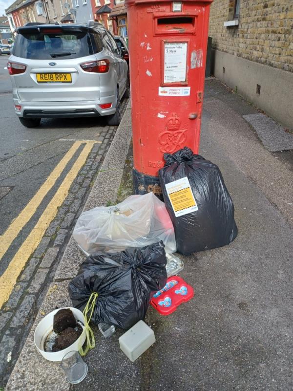 Bags of household waste fly tipped beside post box, at 1 Lidfon Road, E13. -1 Liddon Road, Plaistow, London, E13 8AN