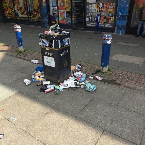Overflowing litter bin and litter on groung-54 Fife Road, Canning Town, London, E16 1QB