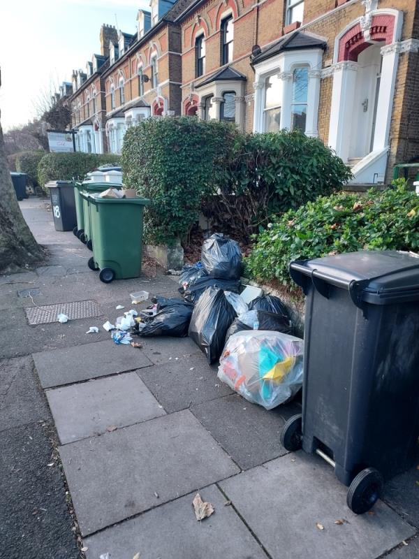 Bags of rubbish outside no.16, rubbish spilling onto streets-16a Pepys Road, Telegraph Hill, SE14 5SB, England, United Kingdom