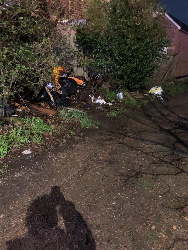 Rubbish dumped in alley by undertaker -644A, Downham Way, Bromley, BR1 5HN