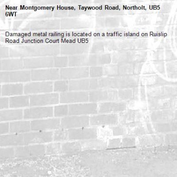 Damaged metal railing is located on a traffic island on Ruislip Road Junction Court Mead UB5 -Montgomery House, Taywood Road, Northolt, UB5 6WT