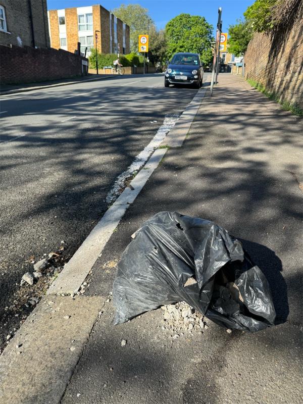 Seems like rubble left in bag here.-Holly Bush Row, Dermody Road, Hither Green, London, SE13 5HB