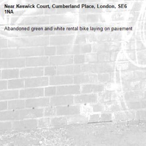 Abandoned green and white rental bike laying on pavement -Keswick Court, Cumberland Place, London, SE6 1NA