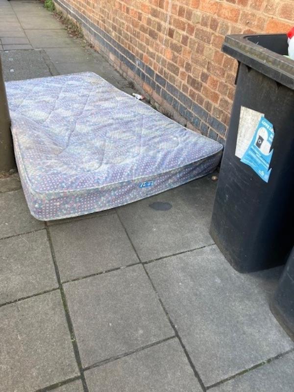 mattress dumped on the pavement-10 Stoughton Street South, Highfields, LE2 0SH, England, United Kingdom