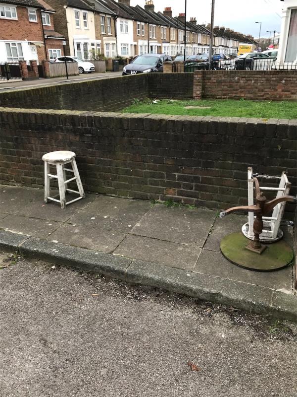 On pavement outside 81-89 Engleheart Road fly tip two stools and small table. -88 Engleheart Road, London, SE6 2HW