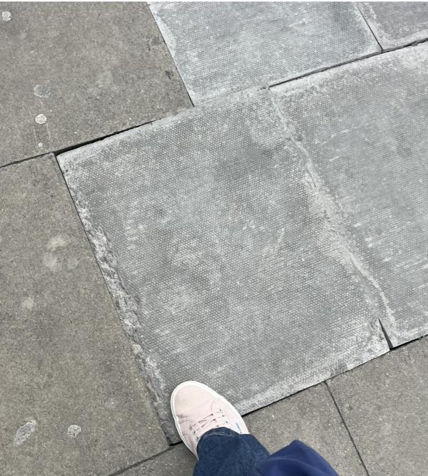 Paving slab uneven, I twisted my ankle on it - it hurt! Dangerous -Green Lanes, London
