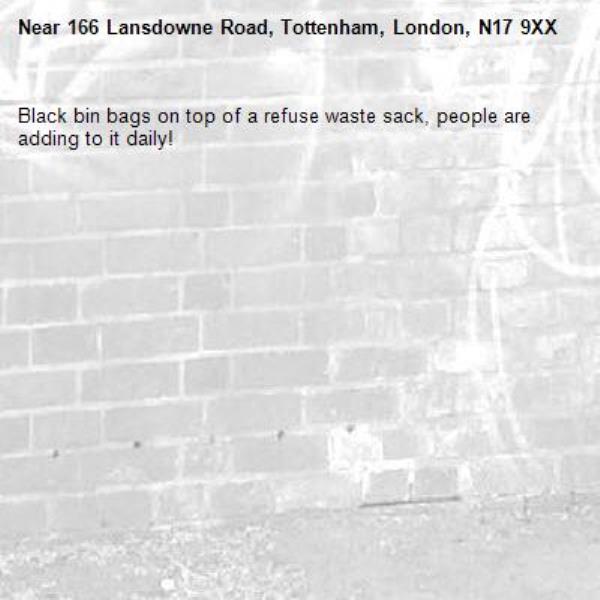 Black bin bags on top of a refuse waste sack, people are adding to it daily! -166 Lansdowne Road, Tottenham, London, N17 9XX