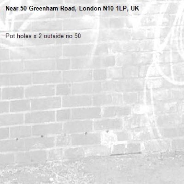 Pot holes x 2 outside no 50 -50 Greenham Road, London N10 1LP, UK