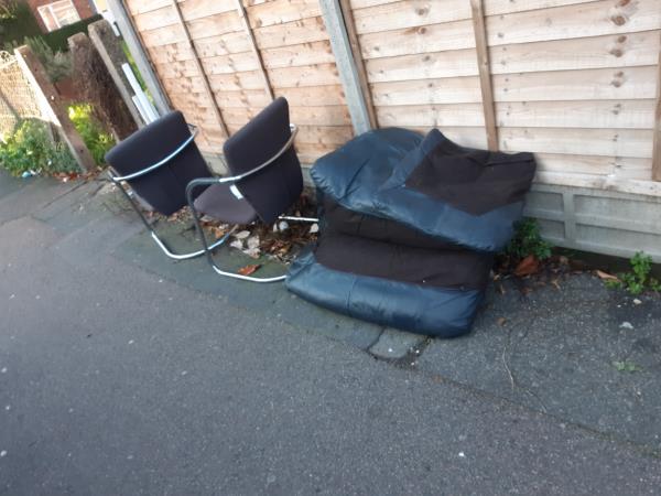 2 dining chairs and a dismantled sofa dumped near 4 Chalk Road E13 -14 Chalk Rd, London E13 8PE, UK