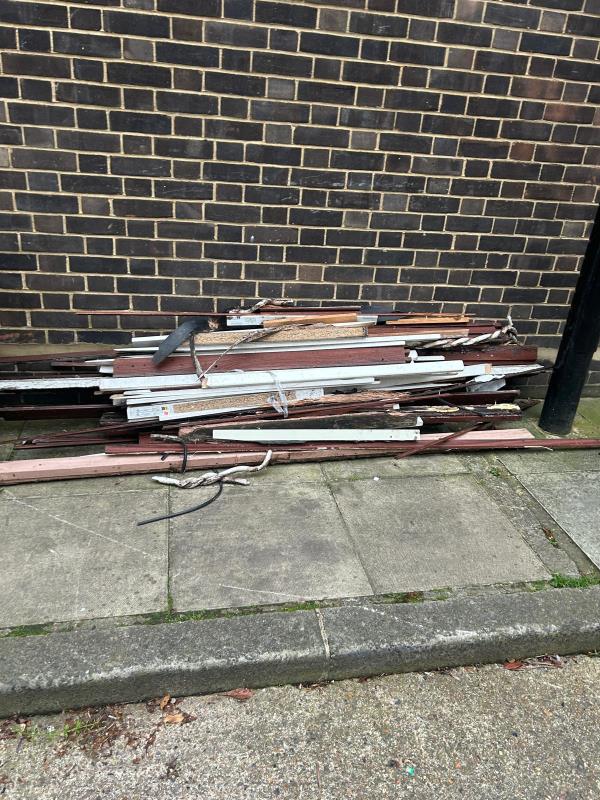 Pile of wood strips dumped by the garage area - As this is a fly tip it will need to be collected by LBL team please-82A, Algernon Road, Ladywell, London, SE13 7AW