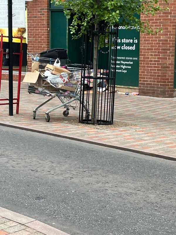 Cardboard and litter outside Holland & Barrett on Horsefair Street -Millstone Lane, Leicester
