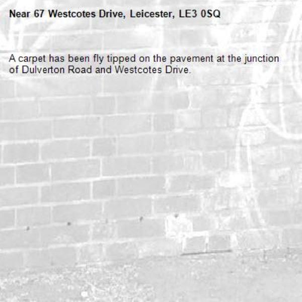 A carpet has been fly tipped on the pavement at the junction of Dulverton Road and Westcotes Drive.-67 Westcotes Drive, Leicester, LE3 0SQ