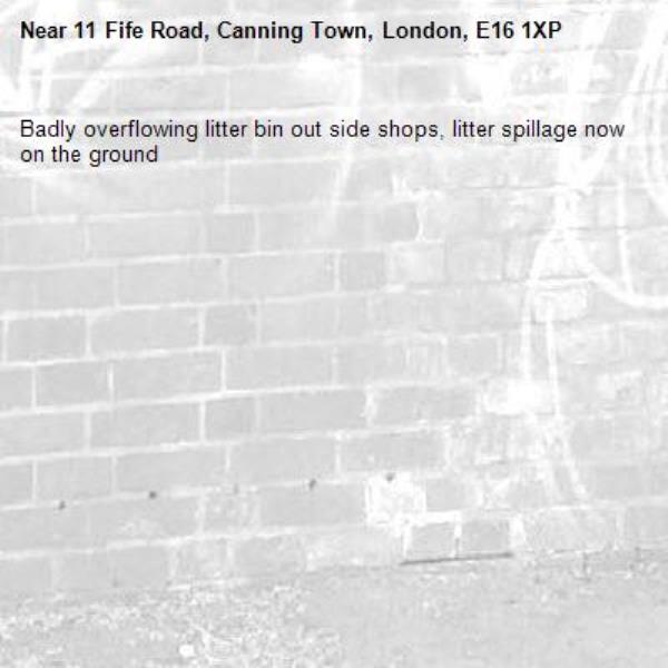 Badly overflowing litter bin out side shops, litter spillage now on the ground-11 Fife Road, Canning Town, London, E16 1XP