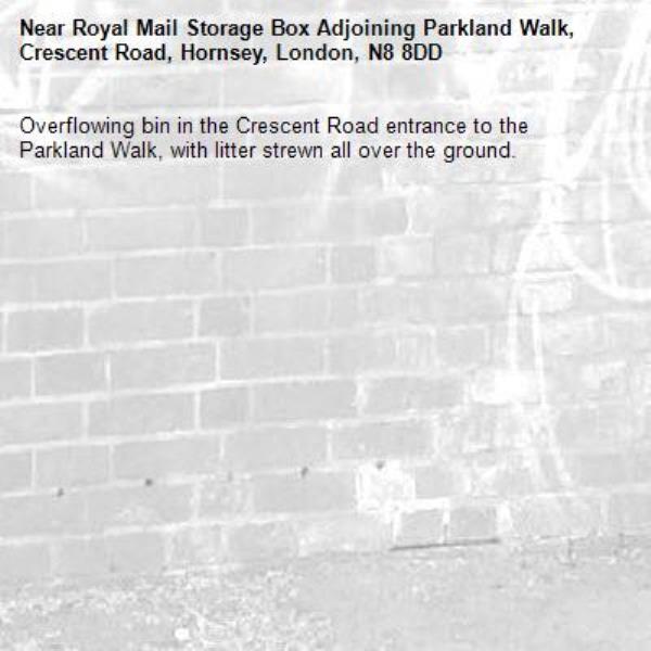 Overflowing bin in the Crescent Road entrance to the Parkland Walk, with litter strewn all over the ground.-Royal Mail Storage Box Adjoining Parkland Walk, Crescent Road, Hornsey, London, N8 8DD