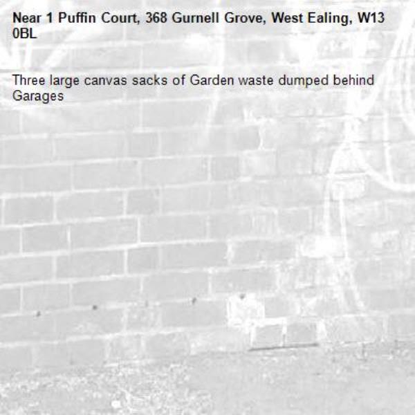Three large canvas sacks of Garden waste dumped behind Garages -1 Puffin Court, 368 Gurnell Grove, West Ealing, W13 0BL