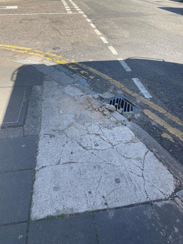 Damaged pavement is located on Horn Lane junction Rectory Road W3-Latitude House, 33 Horn Lane, Acton, W3 9NJ