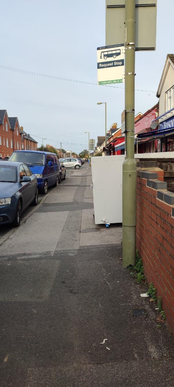 Giant fridge which been there for over 2 years! Has yet again been moved so it's half on the pavement -Shukrana Ltd, 84 Queens Road, Farnborough, GU14 6JR