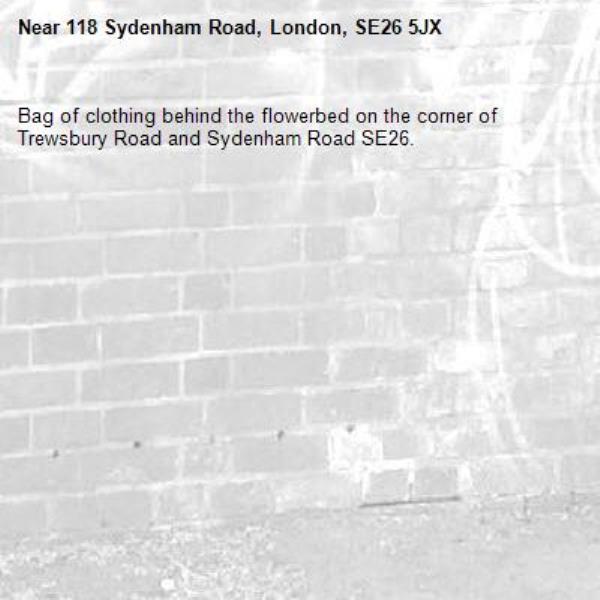 Bag of clothing behind the flowerbed on the corner of Trewsbury Road and Sydenham Road SE26.-118 Sydenham Road, London, SE26 5JX
