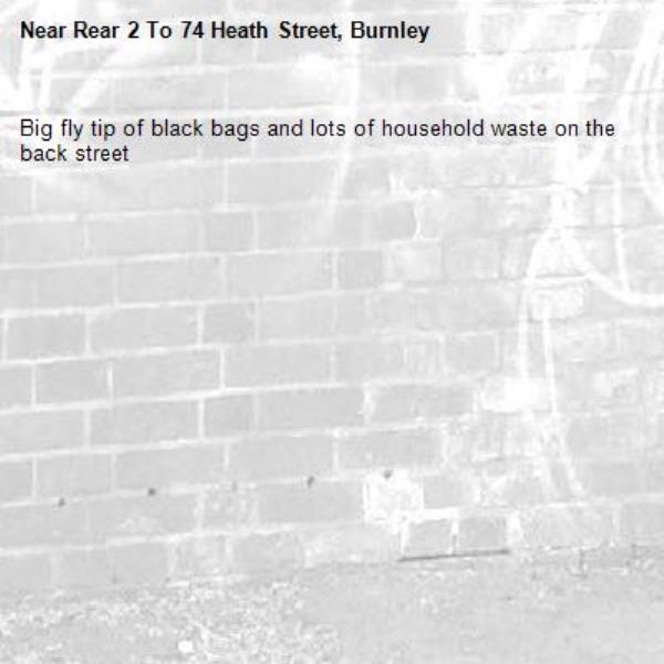 Big fly tip of black bags and lots of household waste on the back street-Rear 2 To 74 Heath Street, Burnley