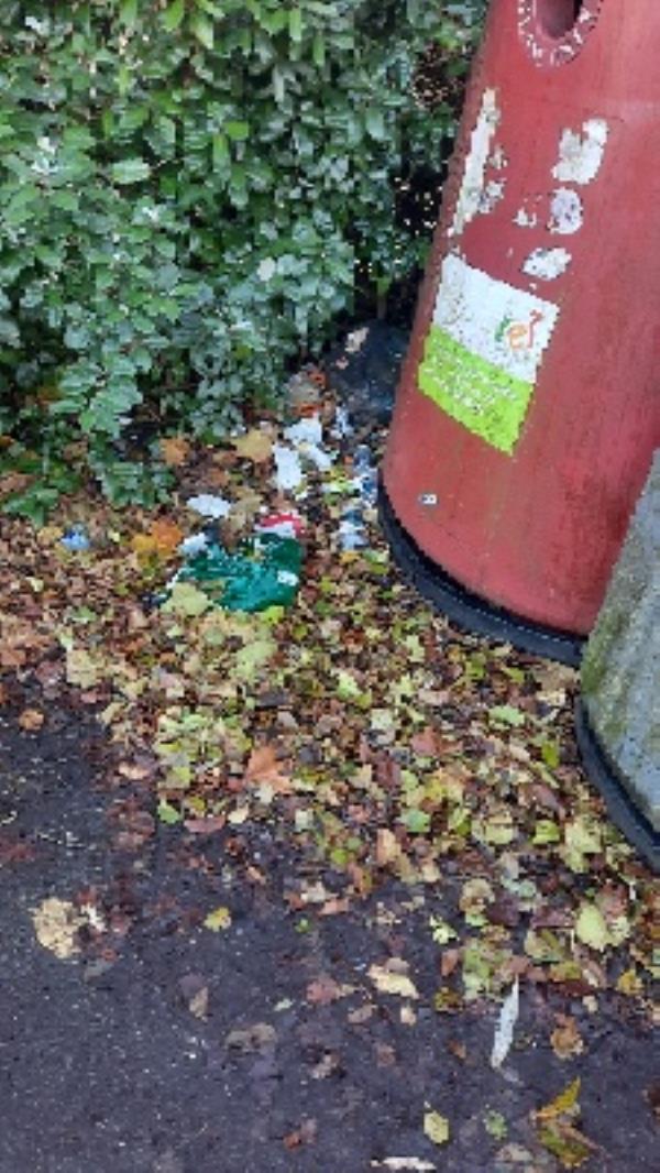 rubbish and litter by bottle bank and bushes-Thames Promenade, Richfield Ave, Reading RG1 8BD, UK