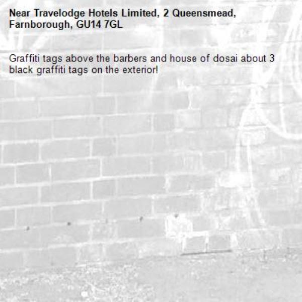Graffiti tags above the barbers and house of dosai about 3 black graffiti tags on the exterior! -Travelodge Hotels Limited, 2 Queensmead, Farnborough, GU14 7GL