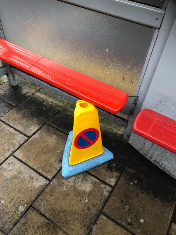 Under bus shelter. Please clear a cone -33 Northover, Bromley, BR1 5JS