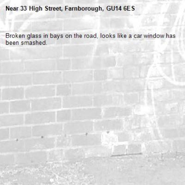 Broken glass in bays on the road, looks like a car window has been smashed.-33 High Street, Farnborough, GU14 6ES
