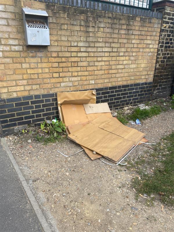 Cardboard boxes dumped by garages next to Kensington primary school -99 Kensington Avenue, Manor Park, London, E12 6NL