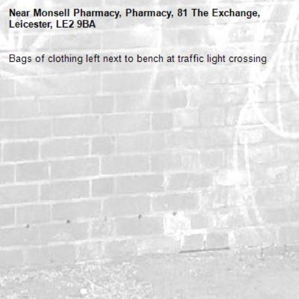 Bags of clothing left next to bench at traffic light crossing-Monsell Pharmacy, Pharmacy, 81 The Exchange, Leicester, LE2 9BA