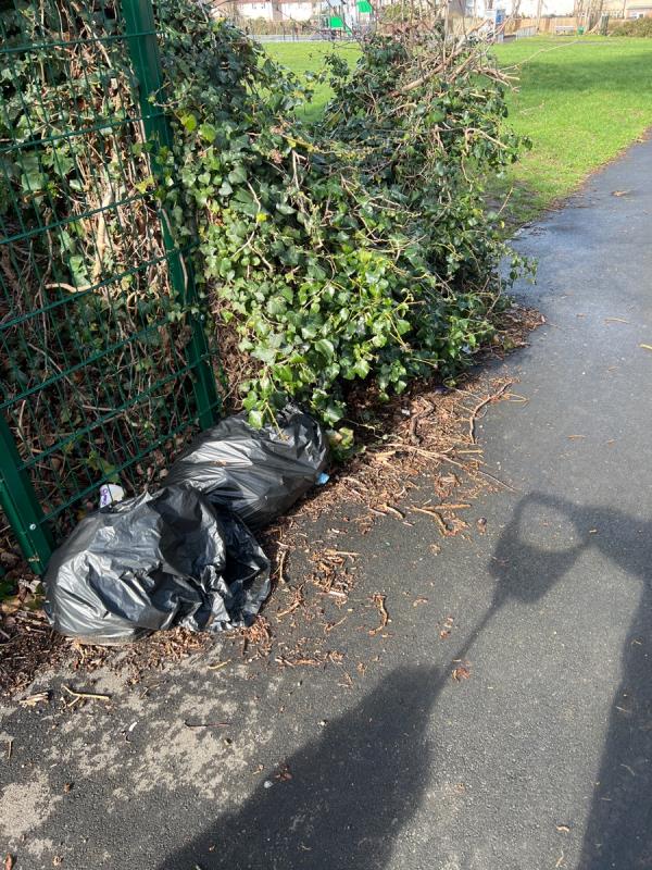 People are dumping their rubish on the pathway to the playground. -811 Oxford Road, Tilehurst, Reading, RG30 6TU